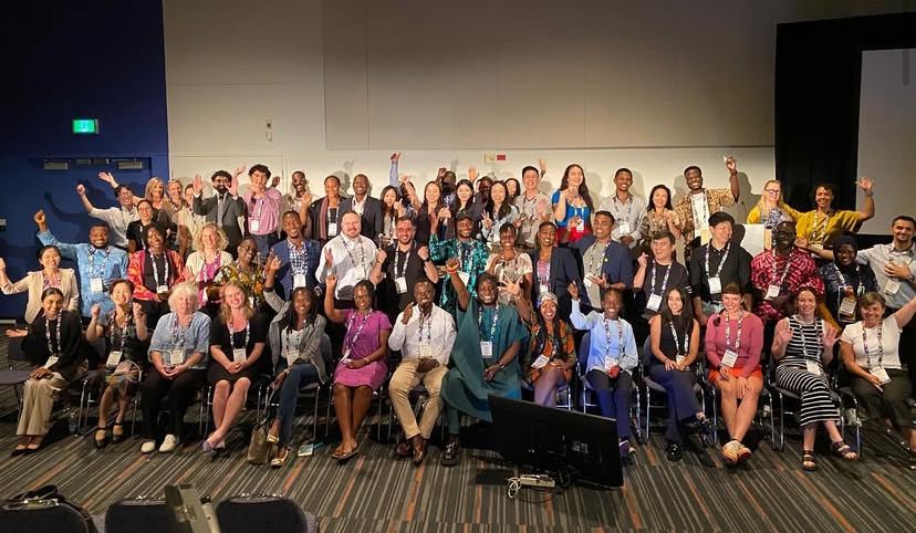 A large group of people pose for a photo