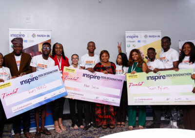 The three winning Designathon teams pose with their checks and INSPIRE leadership and judges.